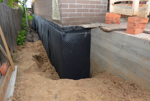 SJ Waterproofing Pros technician performing targeted Sump Pump Installation assessment in Spring Valley, OH
